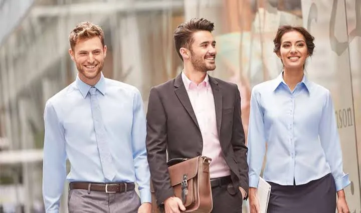Professional corporate team in tailored business uniforms — enterprise manufacturing quality